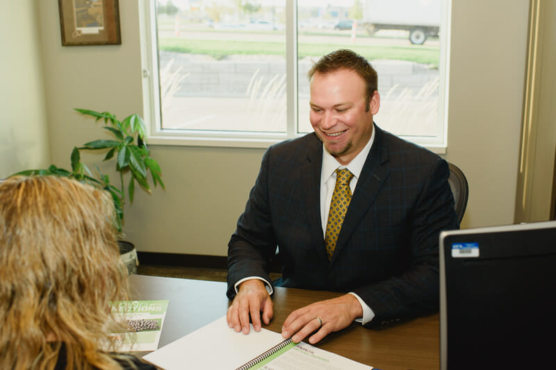 Scott Den Boer helping a customer