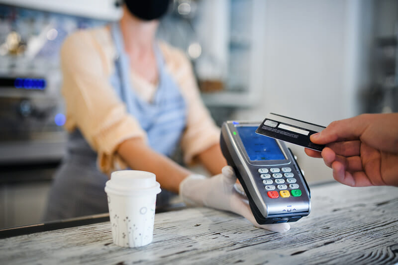 Paying with credit card at coffee shop