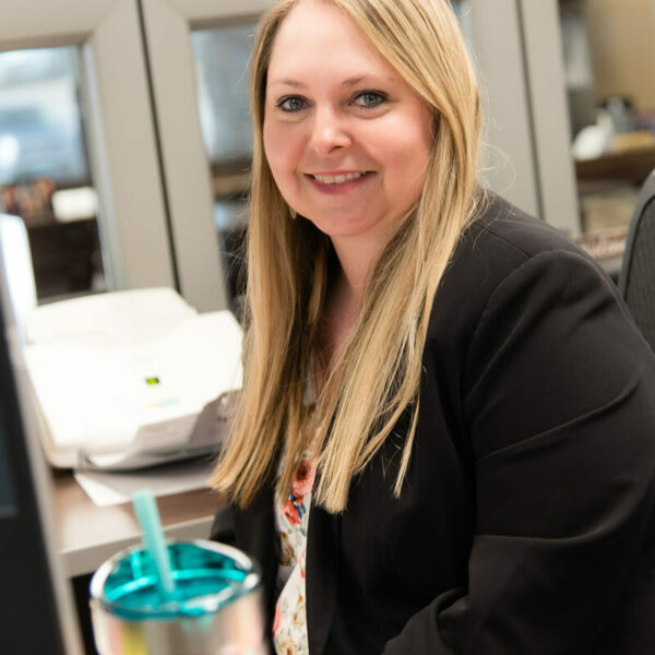 Laura Erdman sitting at her desk